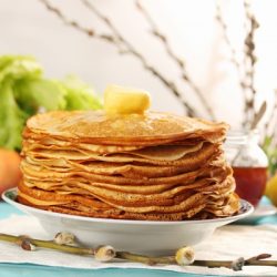 pile of thin pancakes on a plate